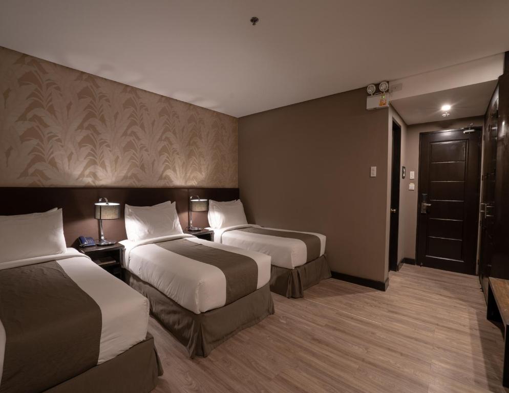 Postel nebo postele na pokoji v ubytování GT Hotel Jaro