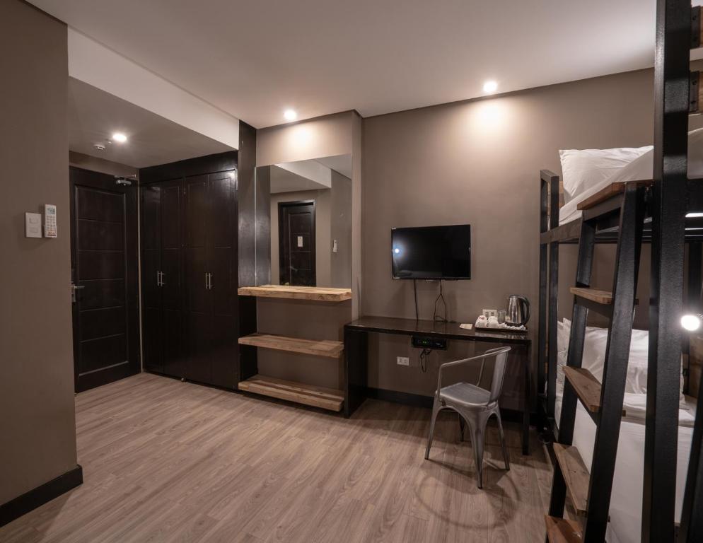 TV a/nebo společenská místnost v ubytování GT Hotel Jaro