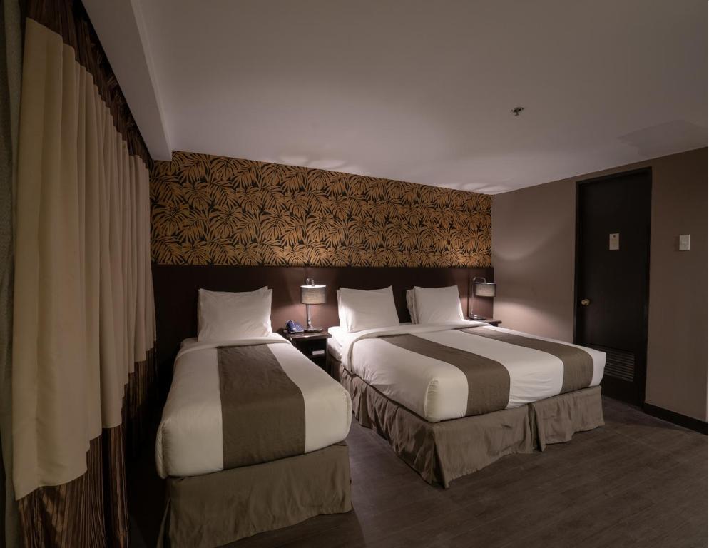 Postel nebo postele na pokoji v ubytování GT Hotel Jaro