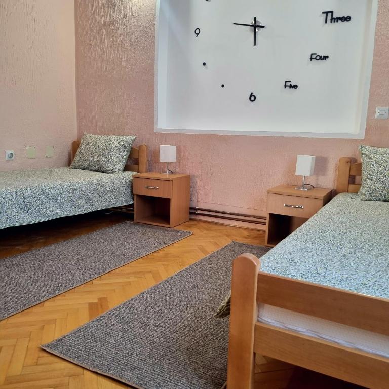 Postel nebo postele na pokoji v ubytování Apartman VEGA