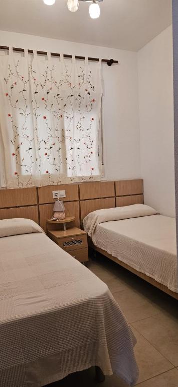 Postel nebo postele na pokoji v ubytování Apartamento acogedor en Magic World, Torre la Sal