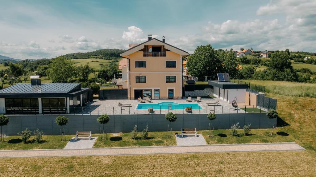 an aerial view of a house with a swimming pool at Villa Lamija in Bihać