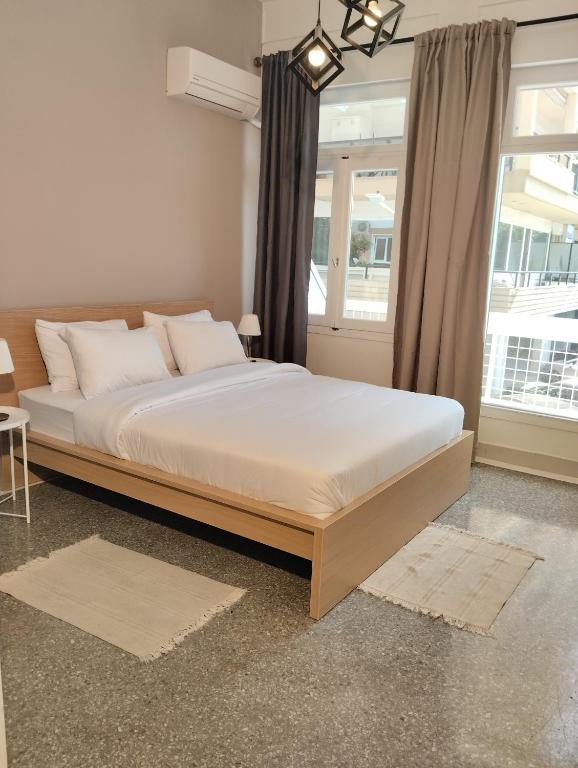 Ένα ή περισσότερα κρεβάτια σε δωμάτιο στο PANSEA 03 IsimeriaHomz