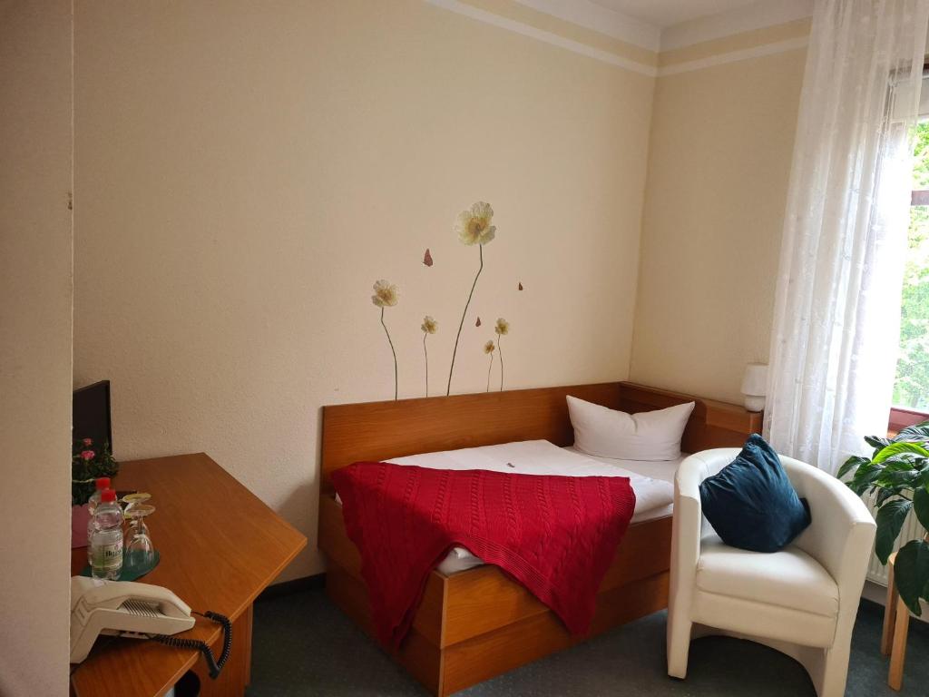 Ένα ή περισσότερα κρεβάτια σε δωμάτιο στο Logis Hotel Stadt Neustadt