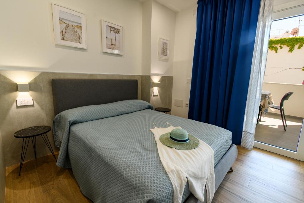 Postel nebo postele na pokoji v ubytování Harbor Rooms - Cala Gonone
