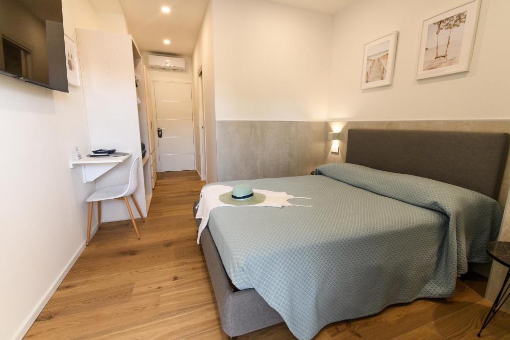 Postel nebo postele na pokoji v ubytování Harbor Rooms - Cala Gonone