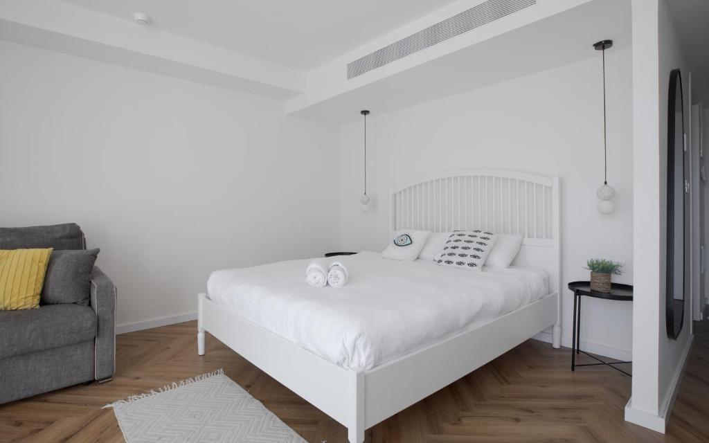 Letto o letti in una camera di סוויטות עם נוף צמודות לים במתחם SeaSide היוקרתי עם בריכה - By SEAELO EILAT