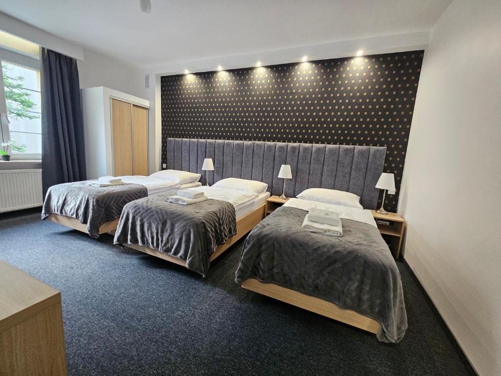 Posteľ alebo postele v izbe v ubytovaní Apartamenty N 25 Przy Kaponierze