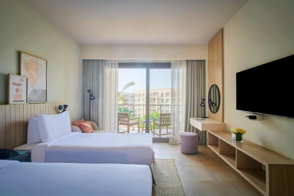 Postel nebo postele na pokoji v ubytování Marassi Boutique Hotel-Marina 2