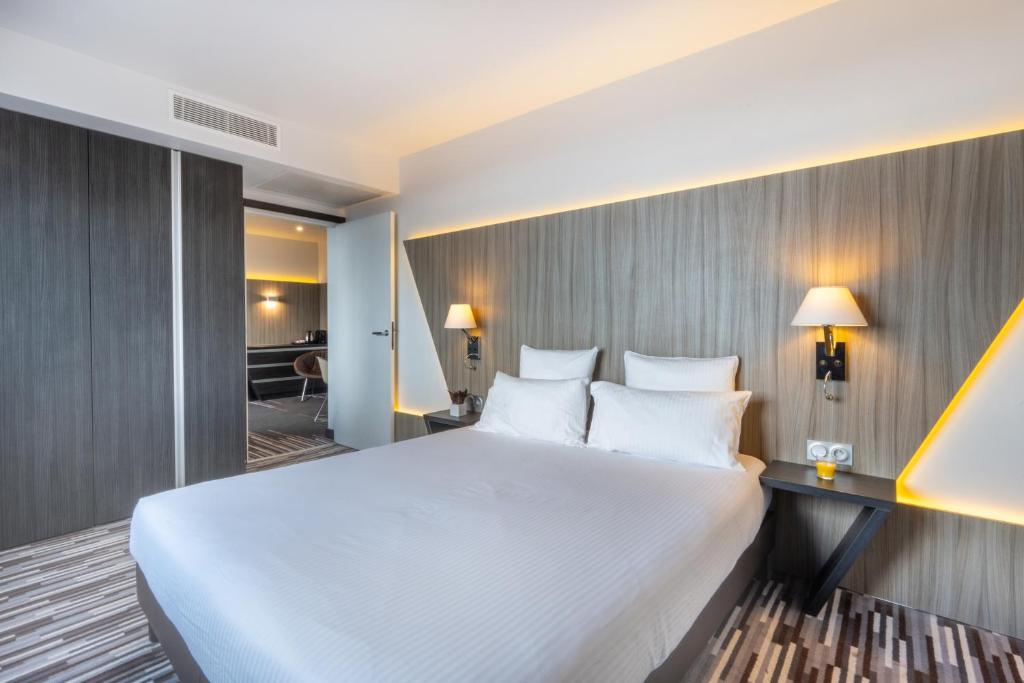 Postel nebo postele na pokoji v ubytování Nemea Appart Hotel Concorde Toulouse Gare Matabiau