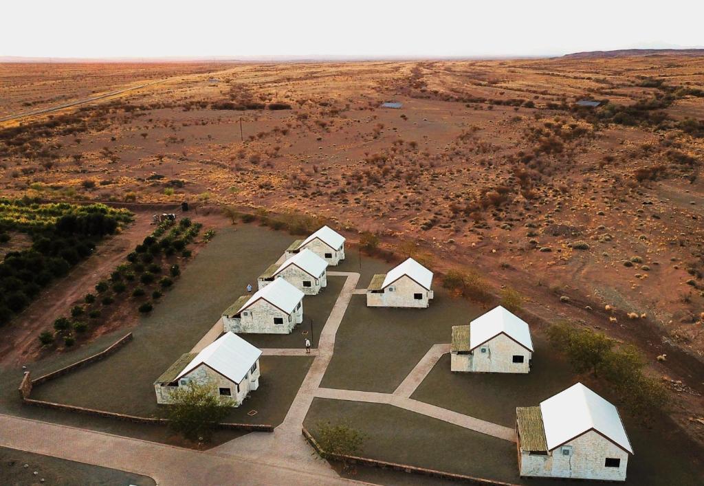 an overhead view of a group of houses in a field at Kitchen51 Cottages in Keetmanshoop