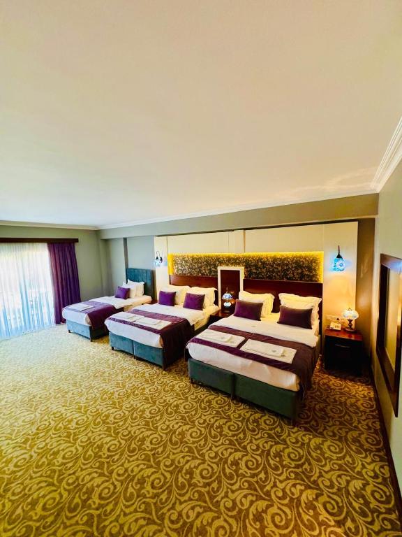 Postel nebo postele na pokoji v ubytování Pamukkale Whiteheaven Suite Hotel