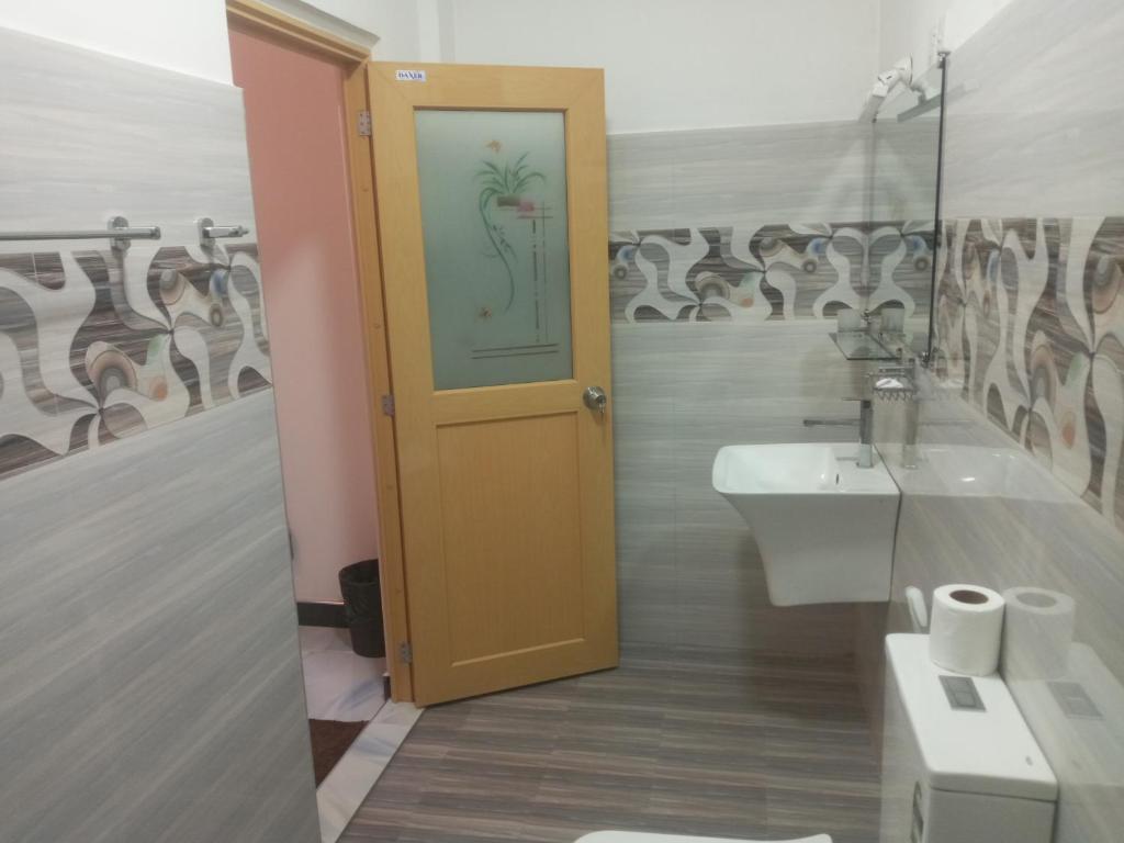 Koupelna v ubytování Kelum Homestay