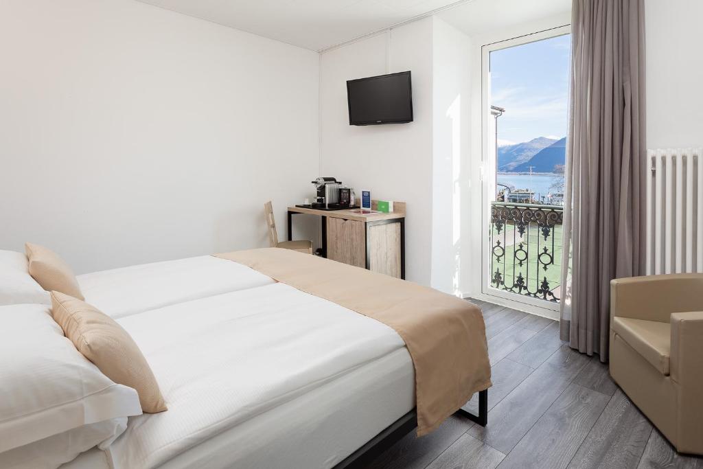 Postel nebo postele na pokoji v ubytování Hotel Du Lac