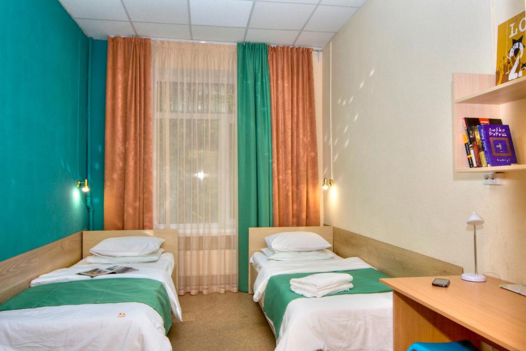 Postel nebo postele na pokoji v ubytování Podolski Hostel