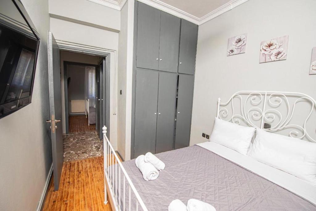 Postel nebo postele na pokoji v ubytování Dimi House
