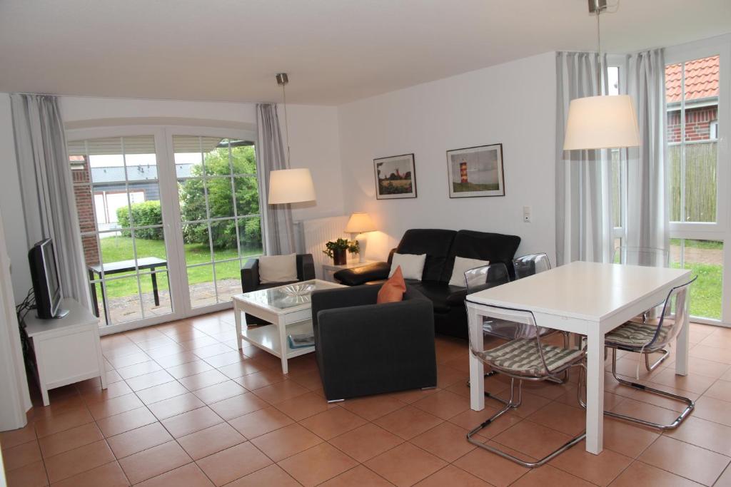 a living room with a couch and a table at Ebbe in Norden