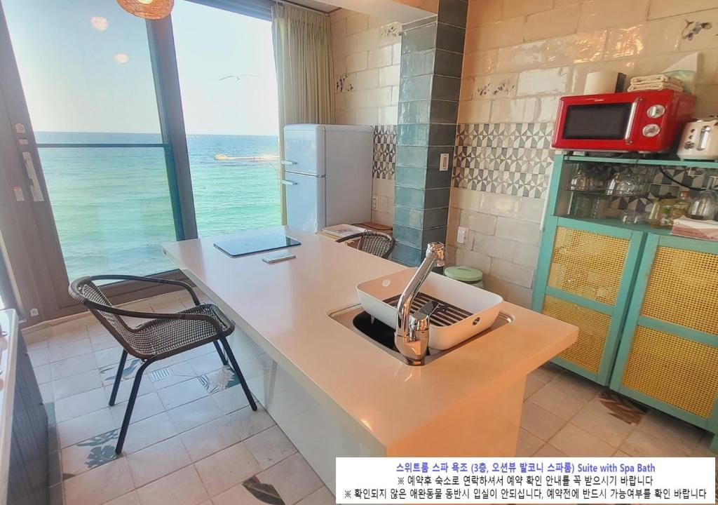 Kuchyň nebo kuchyňský kout v ubytování Seaside Pension