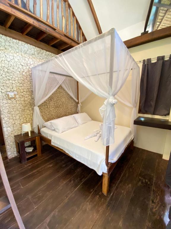 Postel nebo postele na pokoji v ubytování Emerald House Village