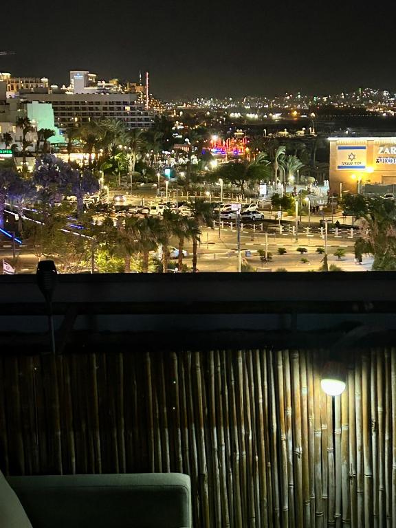 a view of a parking lot at night at Roof top glamping and Toys suites in Eilat