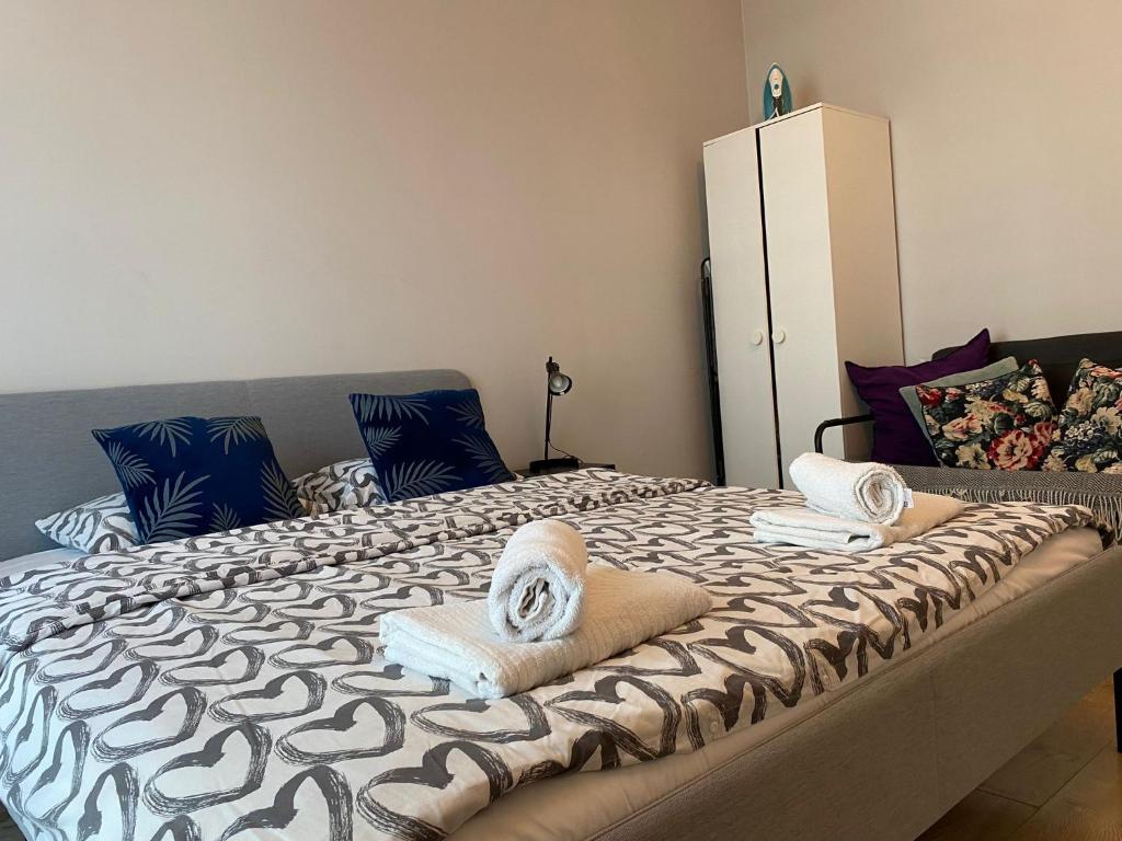 Posteľ alebo postele v izbe v ubytovaní Marcina Kasprzaka 29c