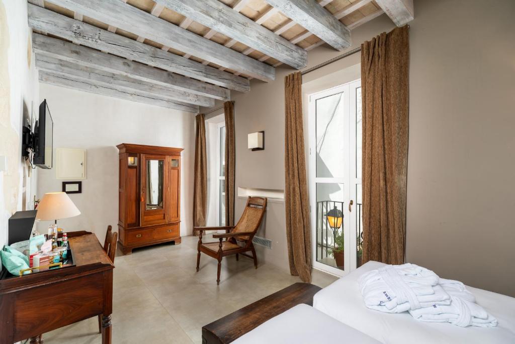 Een bed of bedden in een kamer bij Hotel Boutique V