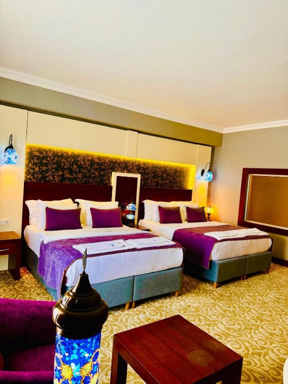 Postel nebo postele na pokoji v ubytování Pamukkale Whiteheaven Suite Hotel