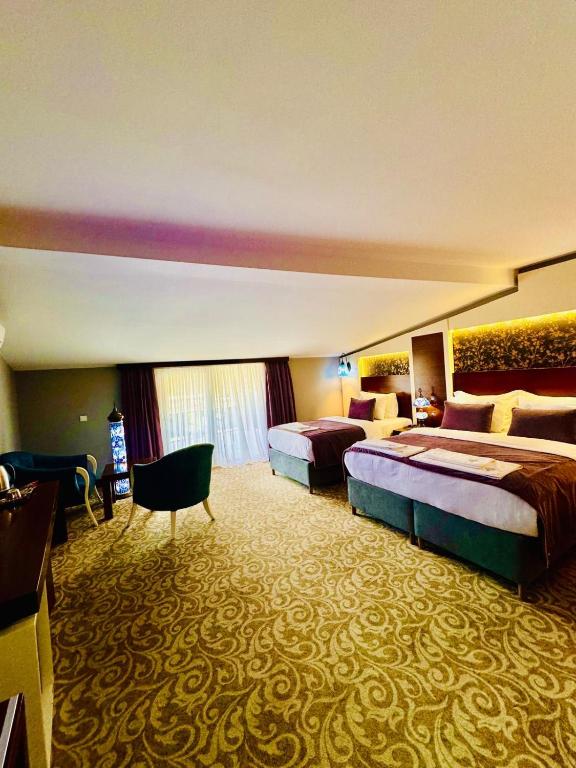 Postel nebo postele na pokoji v ubytování Pamukkale Whiteheaven Suite Hotel