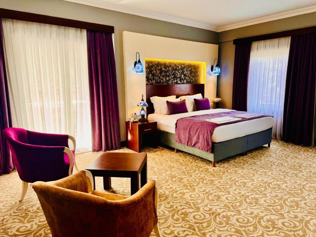 Postel nebo postele na pokoji v ubytování Pamukkale Whiteheaven Suite Hotel