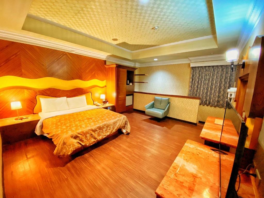 Postel nebo postele na pokoji v ubytování Hua Xiang Motel - Nanzih