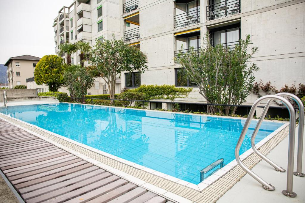 Bazén v ubytování Hotel Nessi Locarno nebo v jeho okolí