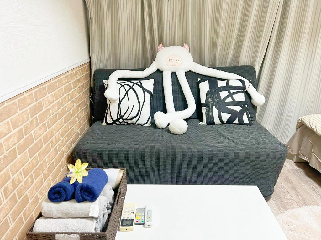 Postel nebo postele na pokoji v ubytování 東新宿1分&新大久保10分