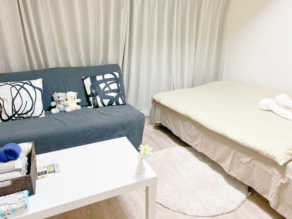 Postel nebo postele na pokoji v ubytování 東新宿1分&新大久保10分