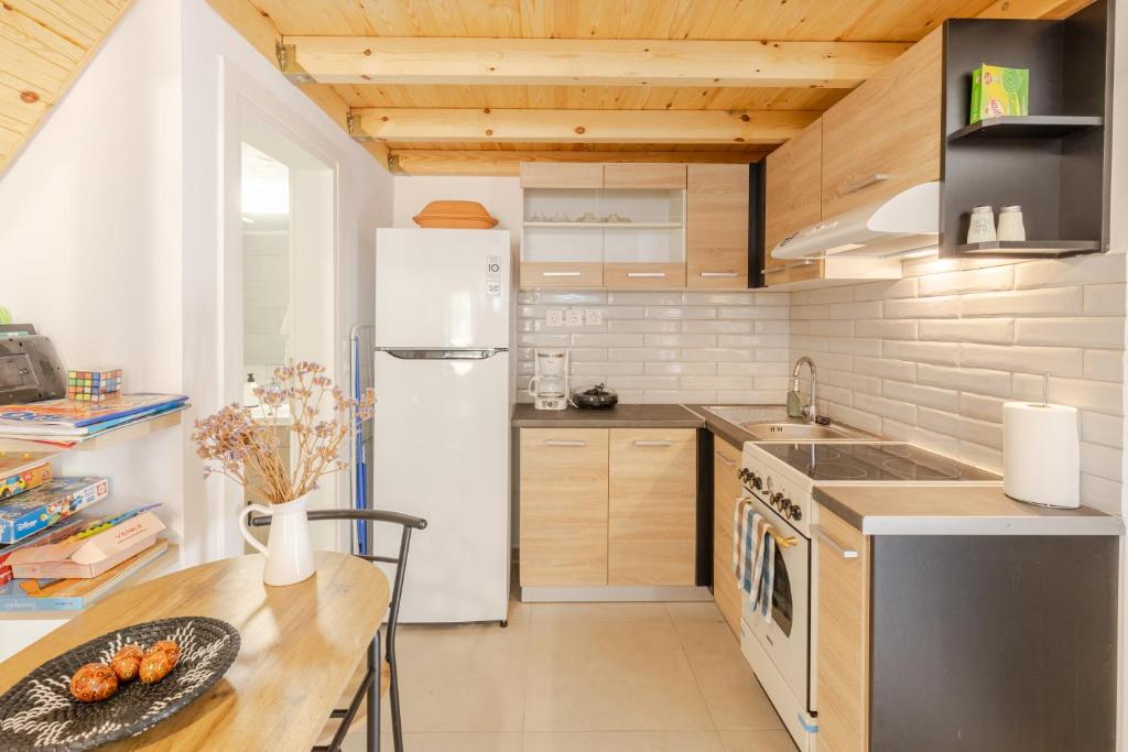 Kuchyň nebo kuchyňský kout v ubytování Soñar Deluxe Cottage