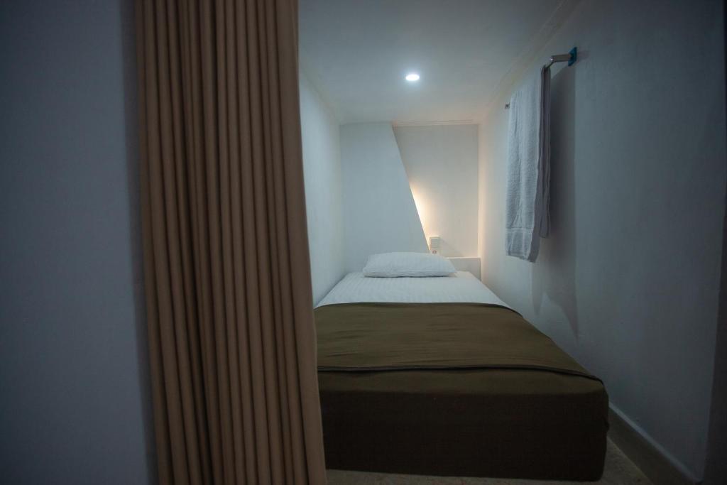 Postel nebo postele na pokoji v ubytování Lucky Hostel