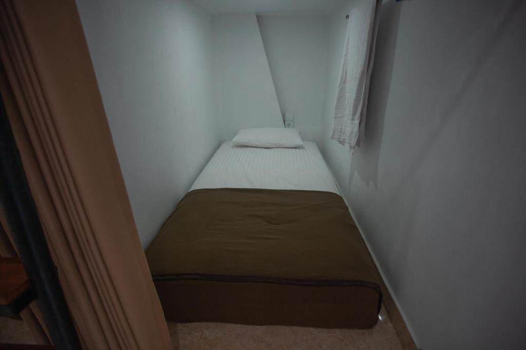 Postel nebo postele na pokoji v ubytování Lucky Hostel