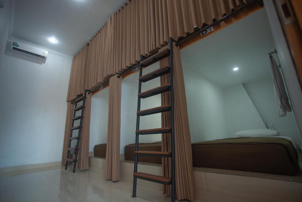 Postel nebo postele na pokoji v ubytování Lucky Hostel