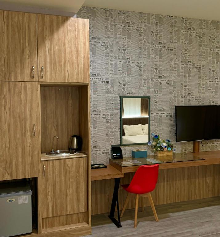 TV a/nebo společenská místnost v ubytování Her Home Spa Motel Douliu
