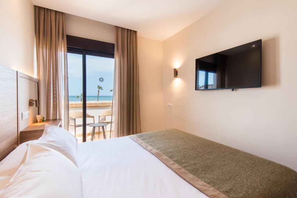 Televízia a/alebo spoločenská miestnosť v ubytovaní Hotel Tarik