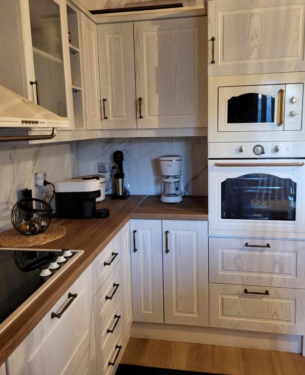 Kuchyň nebo kuchyňský kout v ubytování Casa Nostra Maisonette
