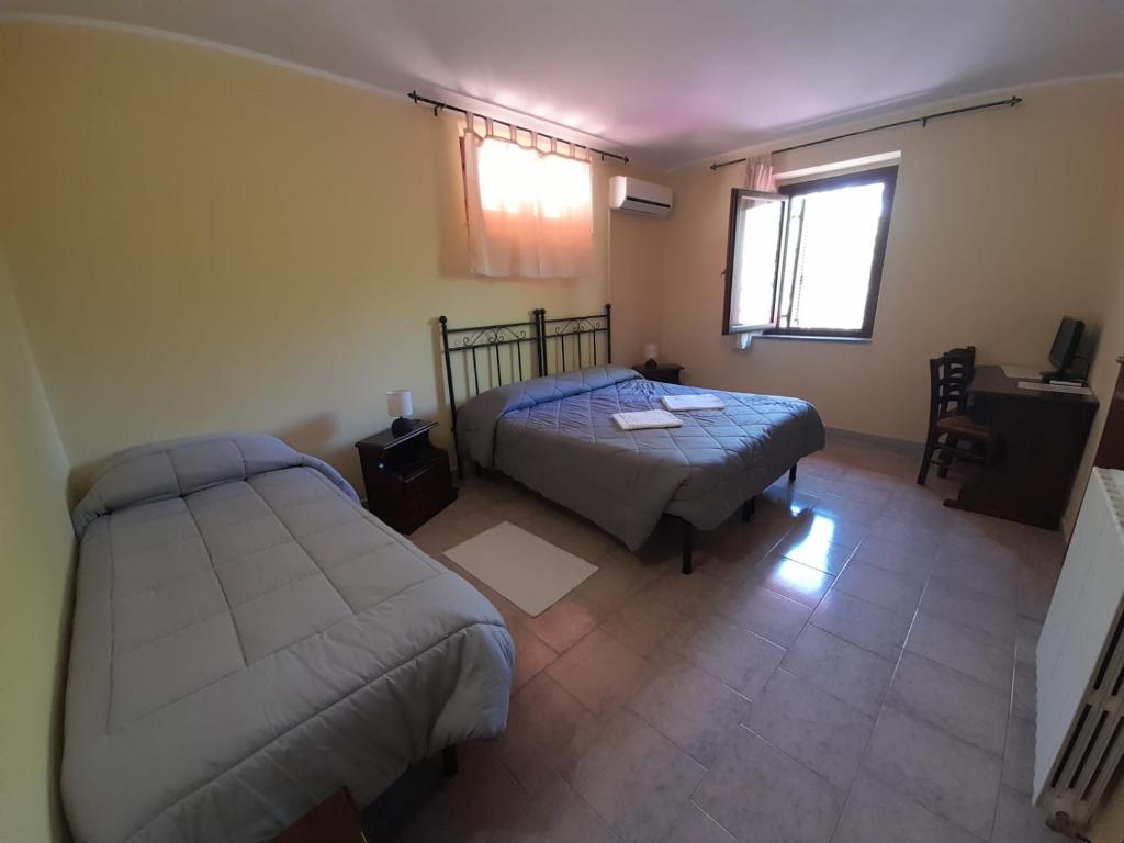 Postel nebo postele na pokoji v ubytování Hotel Sant'elene
