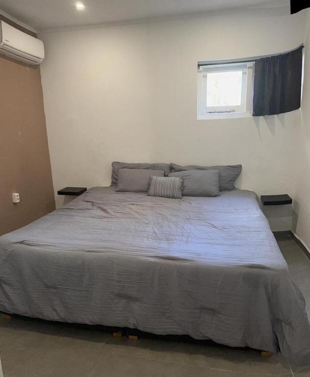 Postel nebo postele na pokoji v ubytování Windmill Apartments Curacao