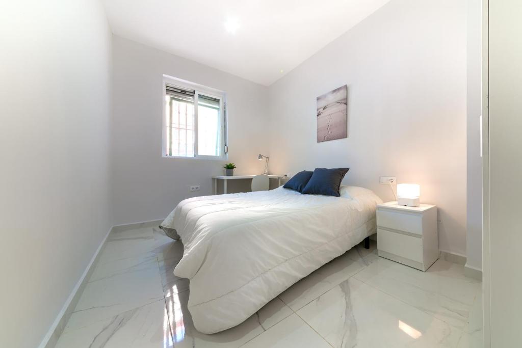 Posteľ alebo postele v izbe v ubytovaní Apartamento San Félix, Playa La Caleta