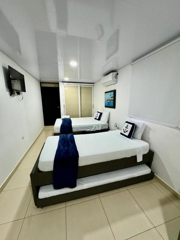 Postel nebo postele na pokoji v ubytování Aloha Beach SAI