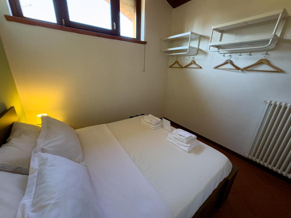 Postel nebo postele na pokoji v ubytování SG Family - Oblò apartment