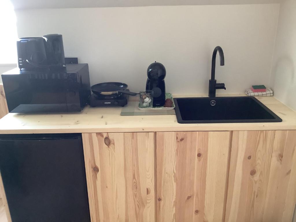 Kuchyň nebo kuchyňský kout v ubytování Mangée
