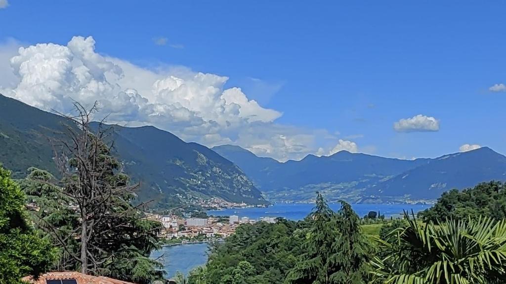 a view of a city and a lake with mountains at Bellavista Iseo in Villongo SantʼAlessandro