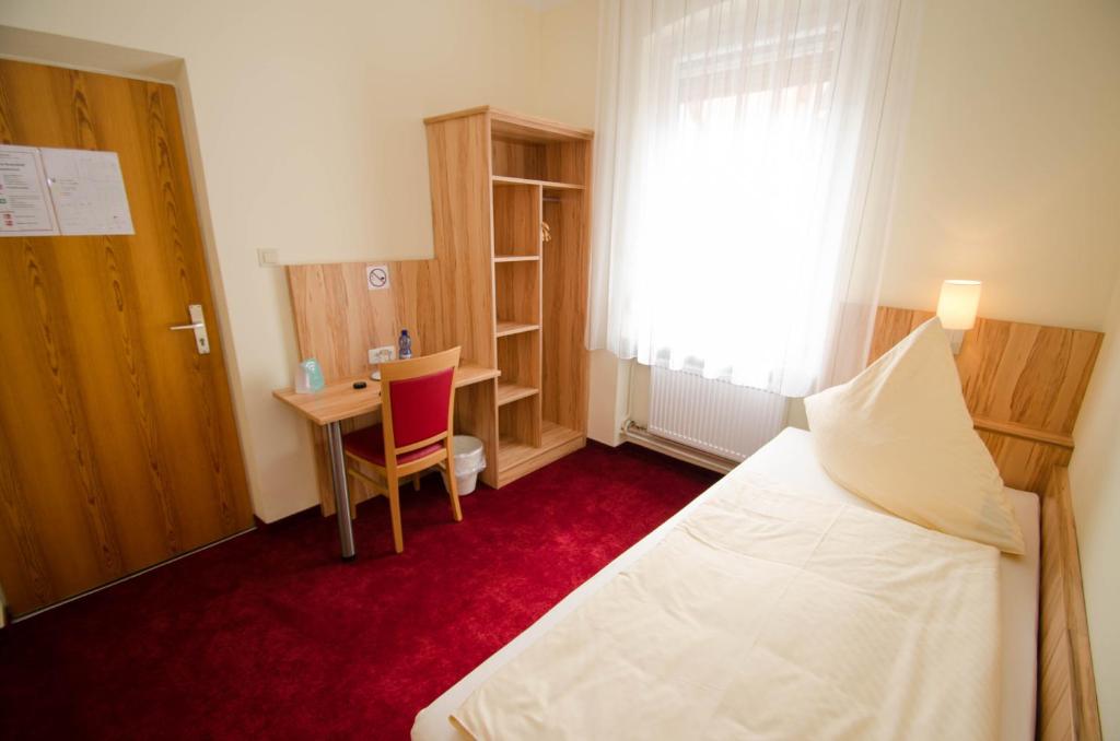 Postel nebo postele na pokoji v ubytování Hotel König Humbert