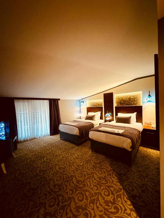 Postel nebo postele na pokoji v ubytování Pamukkale Whiteheaven Suite Hotel
