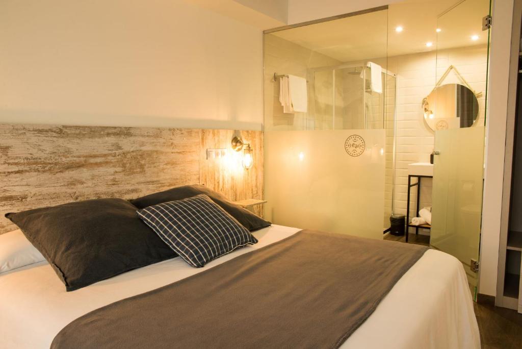 Postel nebo postele na pokoji v ubytování Apartamentos Estela de Altamira